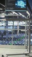 Vertical PC monitor on data center industrial platform displaying hardware status for AI training workflows. Workstation screen tracking servers processing machine learning datasets in industrial environment video