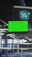 Vertical Industrial platform workstation in automated data center displaying deep learning code on isolated screen laptop. Server room mockup notebook running AI models monitoring operational stability video