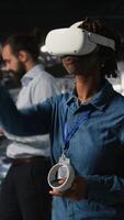 Vertical Data center programmer using virtual reality technology to simulate artificial intelligence neural networks. Woman in server farm using VR headset equipment to oversee AI systems, camera A video