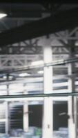 Vertical System administrators in data center using laptop to monitor neural network LLM visualization. Server hub teamworking colleagues overseeing rigs powering machine learning processes, camera B video
