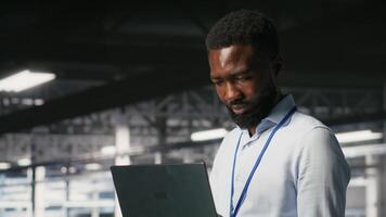 IT experts on data center industrial platform pleased by neural network outputs after completing AI software updates. Cheerful system administrators finetuning server rig configurations, camera B video