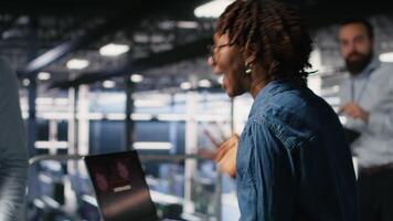 Data center programmer panicking after receiving critical error popup on laptop display. Server farm worker alerted by bugs causing low hardware performance while troubleshooting systems, camera B video