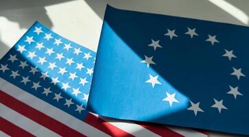 Background of the flags of the USA and European Union. The concept of interaction or counteraction between the two countries. International relations. political negotiations. Sports competition. photo