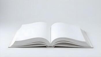 An open book, showcasing pristine white pages ready for content on a seamless backdrop. photo