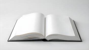An open hardcover book with blank white pages sits on a plain white surface, ready. photo