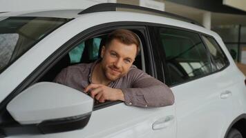 Happy customer showing car keys in dealership video