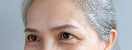 A close up of an older woman's face photo