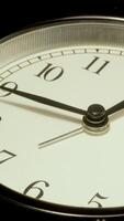 A close up of a clock with the time video