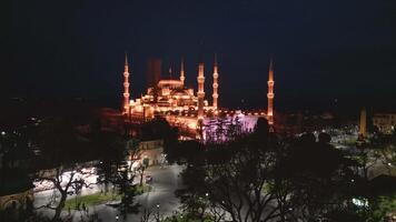 Night view of an illuminated historical mosque in Istanbul video