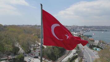 Turkish flag waving over the Bosphorus with Istanbul skyline in the background video