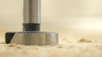 Woodworking tool carves through soft surface in workshop video