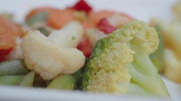 Fresh vegetables and fries displayed in a bright setting video