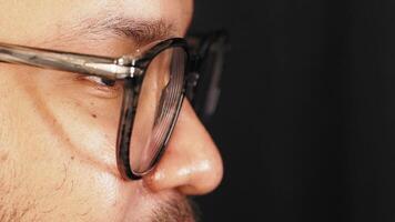 Man wearing glasses shares thoughts on personal style video