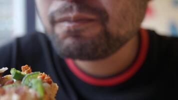 Enjoying a delicious pizza slice at a local eatery video