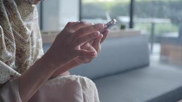 Woman using smartphone indoors in modern setting video