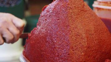 Homemade red chili paste preparation in a local kitchen video