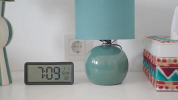 Relaxing morning with cozy lamp and clock display video