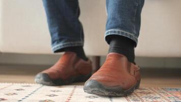 Comfortable shoes and casual style in a cozy setting video