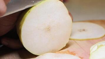Perfectly slicing a pear for a fresh dessert preparation video
