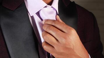 Elegant tie knotting for formal occasions and events video