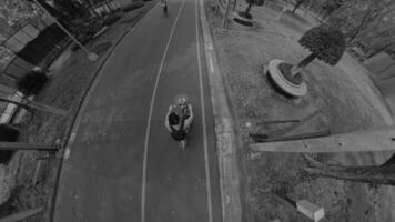 An Engaging Dynamic Urban Scene Featuring Cyclists Captured in Striking Black and White video