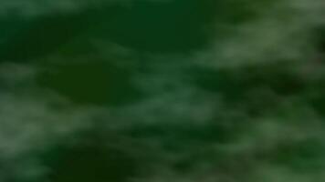 Clouds drifting in soft green blur. Serene nature backdrop for website, graphic design, advertising, or mindfulness content. Peaceful atmosphere. video