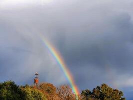 Beautiful image of a rainbow in nature after the rain photo
