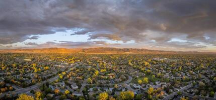 early morning with clouds over Fort Collins and foothills of Rocky Mountains in northern Colorado, springtime aerial view photo