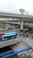 Aerial view of chaotic traffic at major intersection in Hanoi, Vietnam, with motorbikes, cars, and flyovers. Ideal for transport, urban life, and infrastructure in Southeast Asia themes video