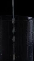 Freshly poured orange juice fills a clear glass creating a refreshing beverage experience video