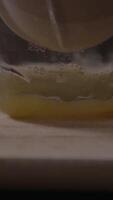Squeezing fresh orange juice in a kitchen with a manual juicer for a refreshing drink video