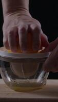 Squeezing fresh orange juice using a manual juicer for a healthy morning beverage and vibrant flavor enhancement video