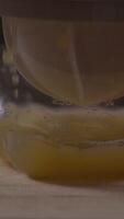 Effortlessly squeezing fresh orange juice for a refreshing morning drink at home in a cozy kitchen setting video