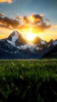A mountain range with a sunset in the background photo