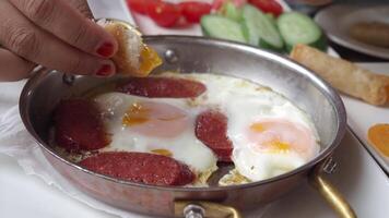 Delicious Breakfast of Eggs and Meat in a Frying Pan with Hands video