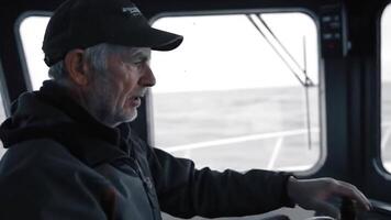 Experienced Captain Navigating the Open Sea Aboard His Vessel video