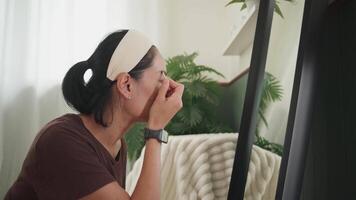 Woman Drawing Eyebrows in Front of Mirror at Home video