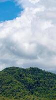 Time lapse of cloudy sky with mountains, nature view during daytime. video