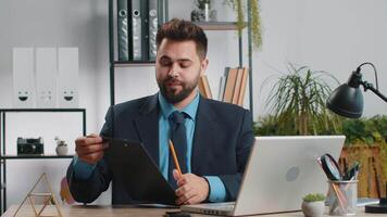 Businessman working on laptop at office talk on online communication call with employee boss video