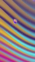 A colorful abstract background with waves and a drop video
