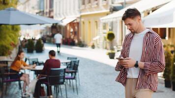 Tourist traveler handsome man using looking smartphone search a way on map in mobile navigator app video