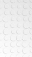 Clean white neomorphism effect background animation with a pattern of gently moving circle shapes. This elegant modern minimalist abstract background full HD and looping. Vertical animation. video