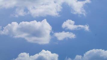 A plane flying in the sky with some clouds video
