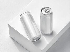 Two blank aluminum cans placed on a white textured surface, one standing upright and the other lying horizontall -Minimalist Beverage Packaging Concept photo