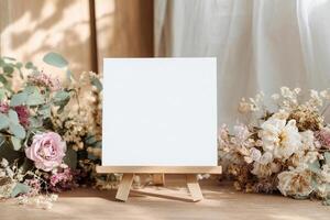 Square Canvas on Easel Displayed with Floral Arrangement for Art, Mockup and Design Project photo