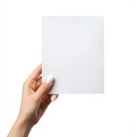 A hand holds a blank white card, ready for a message or design against a clean background photo