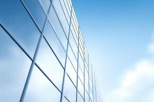 Modern architecture soars with a glass facade reflecting the blue sky, blending sky and structure photo