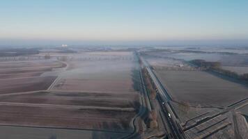 An aerial view of a field and a train track video