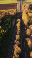 Aerial view of a highway with trees and fields video