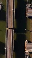 An aerial view of a bridge with boats on it video